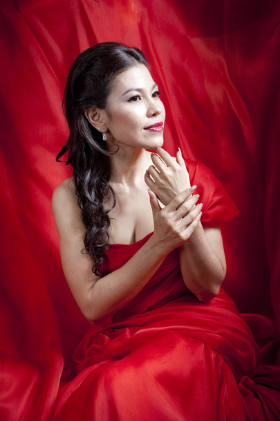 Beautiful asian woman in red dress - Photo, image