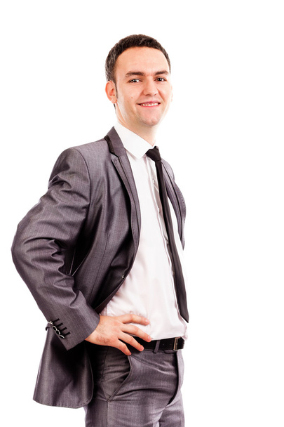 Smiling young business man with hands on hips - Foto, Bild