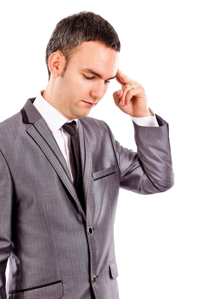 Portrait of a young businessman thinking hard - Foto, Imagen
