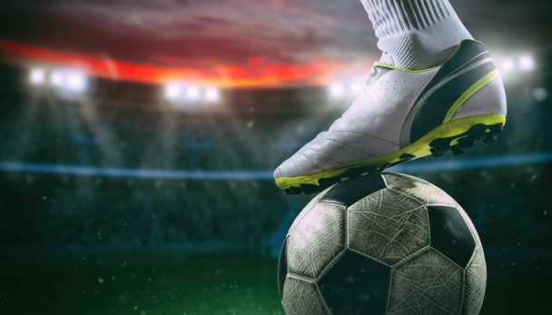 Close up of a soccer striker ready to kicks the ball at the stadium - Photo, Image