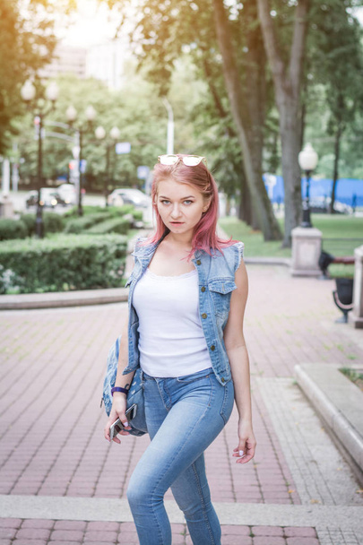 stylish hipster girl in denim clothes on a city street - Zdjęcie, obraz