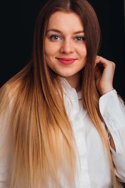 young woman smiles cute and look at camera. white blouse and yel - Fotografie, Obrázek