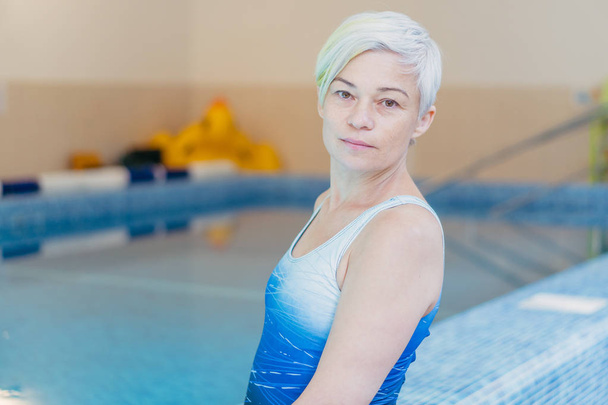 Pool. Portrait of a swimming coach woman and a watsu master - Фото, изображение