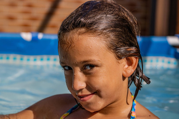 Little girl in the pool - Photo, Image