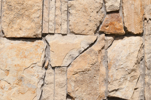 Η υφή του τοιχώματος των μεγάλων θραύσματα της φυσικής πέτρας. - Φωτογραφία, εικόνα