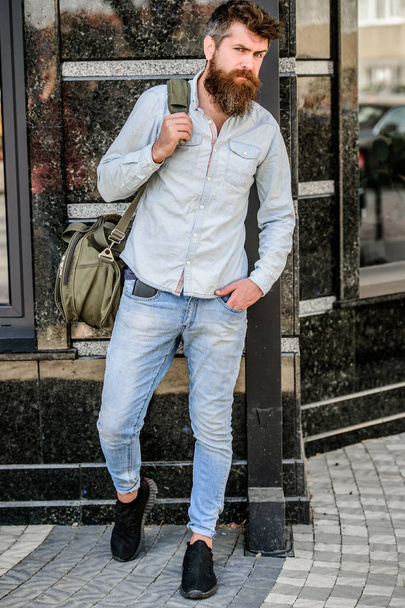 Mature hipster with beard. Bearded man walking on street. modern male fashion. ready for adventure. brutal caucasian hipster with moustache. urban style. vacation discovery. wanderlust concept - Zdjęcie, obraz