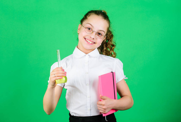 Good news. science research in lab. Small school girl. child study bilogy lesson with note. small smart girl with testing flask. education and knowledge. back to school. Scientific researches - 写真・画像