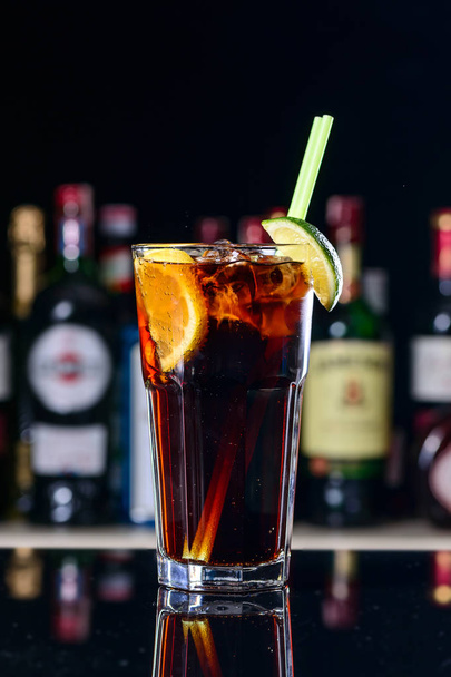 classic cocktail cuba libre with ice and close-up in a cuban bar - Fotó, kép