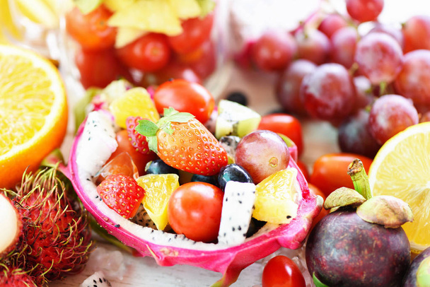 Fruit salad bowl served in a dragon fruit and vegetables healthy - Photo, Image