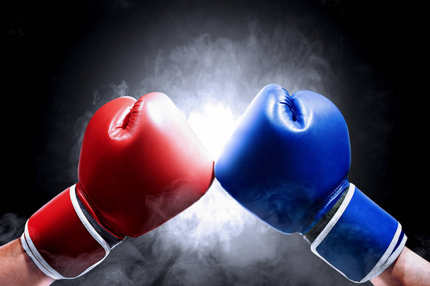 Hands of two men with blue and red boxing gloves - Φωτογραφία, εικόνα