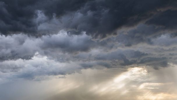 Dark stormy clouds background. Dramatic stormy sky with dark hea - Fotó, kép