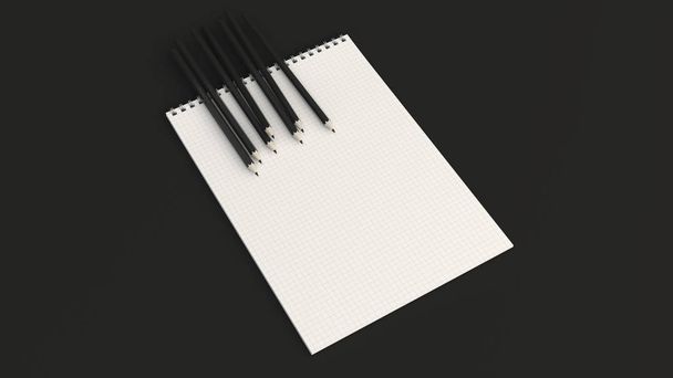Notebook with black pencils - Φωτογραφία, εικόνα