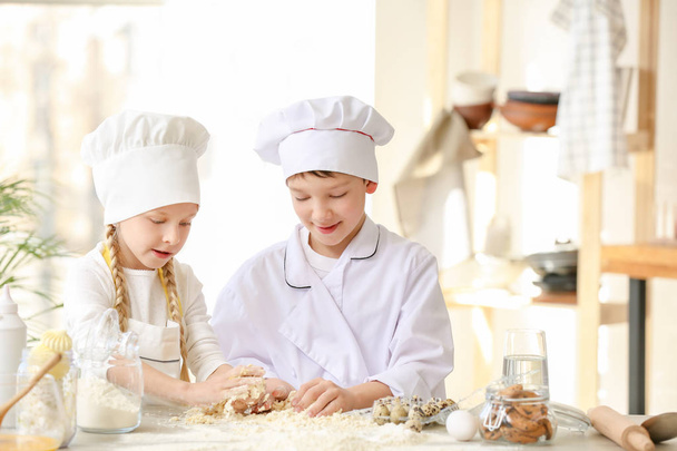 Cute little chefs cooking in kitchen - Photo, Image