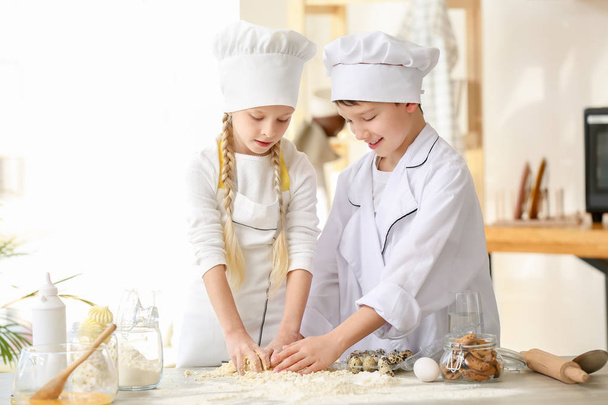 Cute little chefs cooking in kitchen - Photo, Image