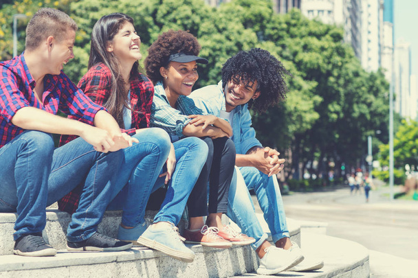 Hispanic and african american hipster young adults in the city - Foto, Bild