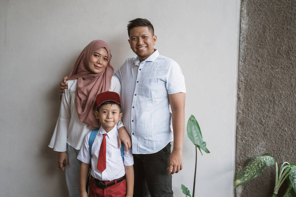 indonesia family with kid wearing school uniform - Fotó, kép
