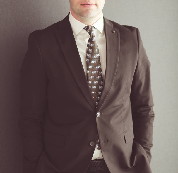 Portrait of a confident mature businessman standing outside. - Фото, изображение