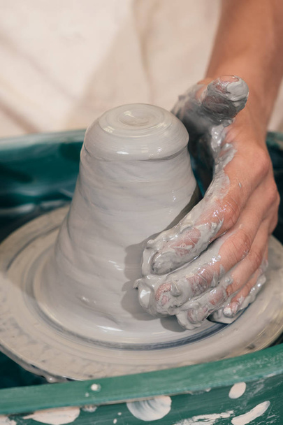 Creating a jar or vase of brown clay close-up. Master crock. Man - Valokuva, kuva