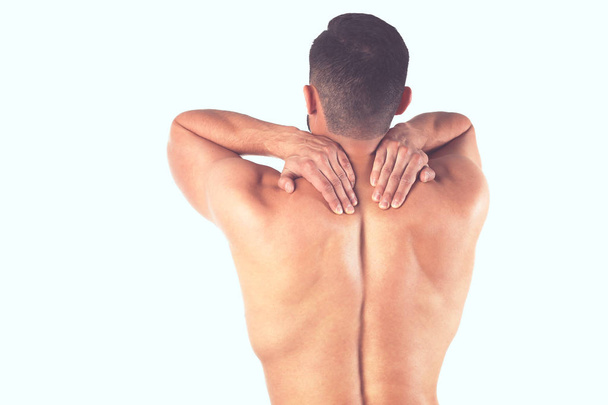 Young man holding his neck in pain. Medical concept - Photo, Image