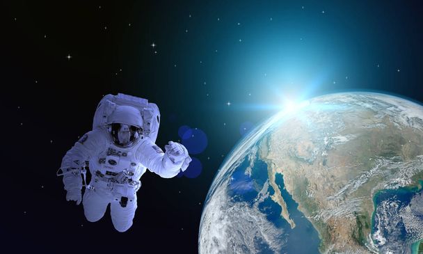 Астронавти пливуть в космосі. Шлях до різання це додаткове зображення прикрашений НАСА - Фото, зображення