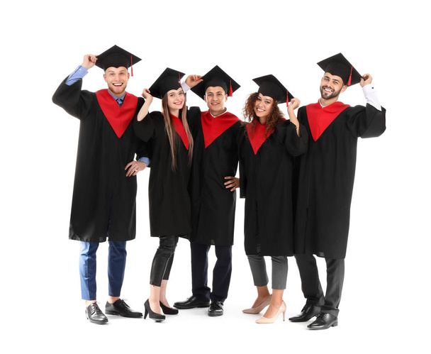 Fiatal diákok a Bachelor köpenyben fehér alapon - Fotó, kép