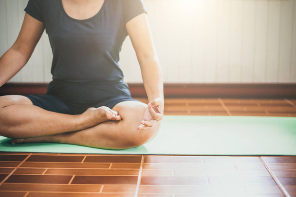 Young woman meditation while practicing yoga  intdoor. Woman exe - Fotografie, Obrázek
