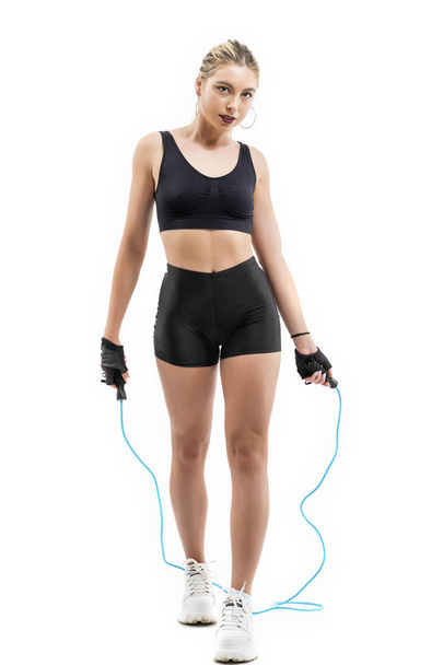 Beautiful sportsgirl with skipping rope isolated on white - Photo, Image