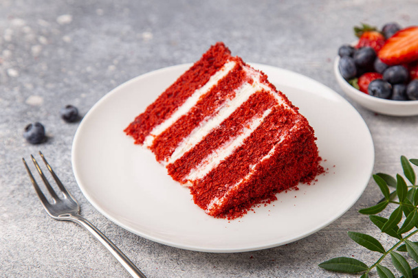 slice of Red Velvet cake on white plate - Fotoğraf, Görsel