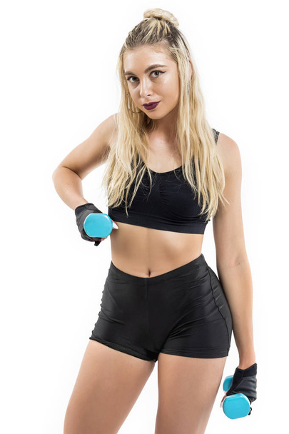 Beautiful fit woman exercising with dumbbells - Foto, Imagem