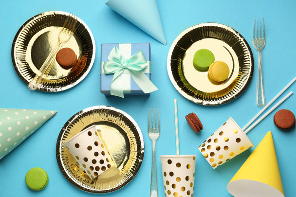 Composition with tableware and Birthday decor on color background - Fotó, kép