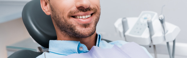panoramic shot of patient smiling in dental clinic  - Foto, immagini