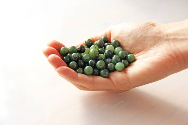 Natural green jade nephrite mineral stones beads. The green jade - Photo, Image