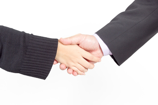 zakenman en vrouwelijke schudden handen, geïsoleerd op wit. Closeup - Foto, afbeelding
