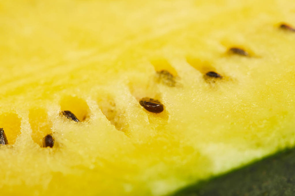 close up view of yellow ripe watermelon with seeds - Φωτογραφία, εικόνα