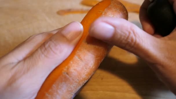 peel carrot with vegetable peelers. - Footage, Video