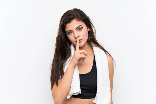 Teenager sport girl over isolated white background doing silence gesture - Valokuva, kuva