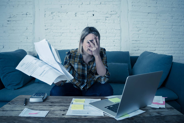 Portrait of desperate young woman feeling stressed checking online banking accounting home finances not able to pay off debts, mortgage, rent and expenses. In paying bills and financial problems. - Photo, Image