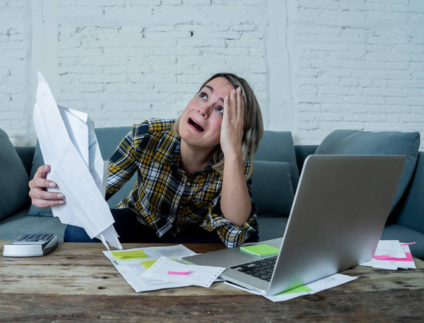 Portrait of desperate young woman feeling stressed checking online banking accounting home finances not able to pay off debts, mortgage, rent and expenses. In paying bills and financial problems. - Foto, Bild