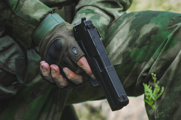 Black green gun pistol on white background - Foto, imagen