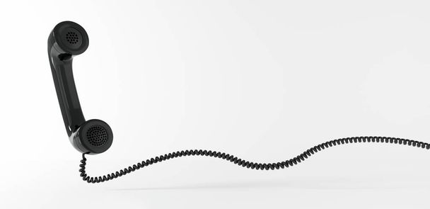 Schwebender schwarzer Telefonhoerer mit Spiralkabel - Foto, Imagem