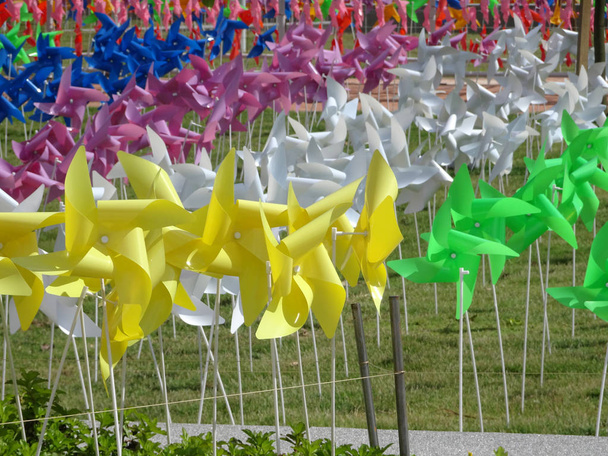 KUALA LUMPUR, MALAYSIA -FEBRUARY 03, 2018: Decorative and colorful pinwheel spinner windmills put together in a group.  - Photo, Image