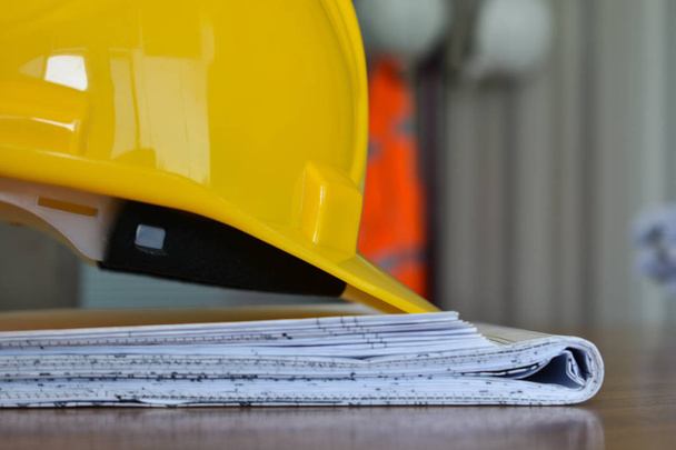 yellow construction helmet on construction project - Фото, зображення