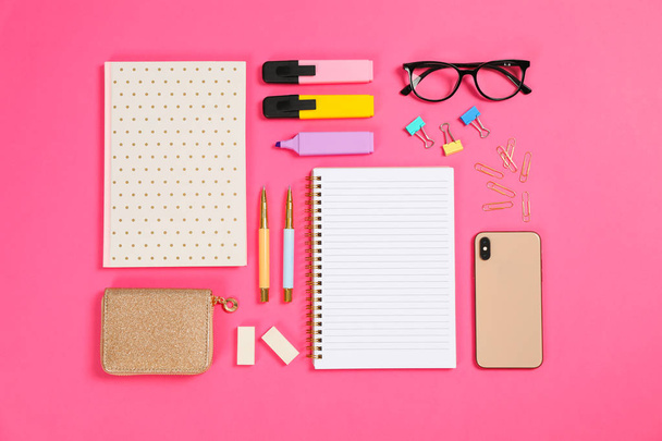 Flat lay composition with stationery on pink background, space f - Photo, image