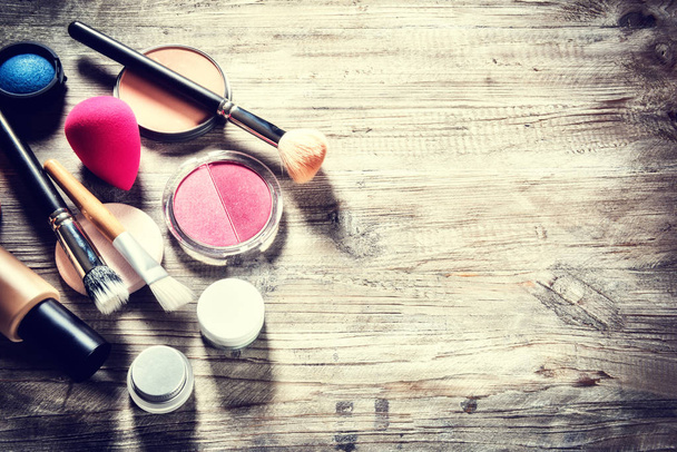 Makeup set with various cosmetic products and brushes - 写真・画像