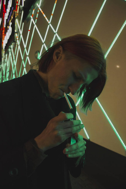 Young guy with a cigarette - Fotó, kép