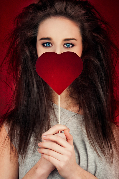 Young woman with heart symbol - Foto, Bild