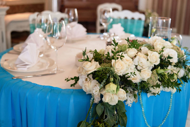Lush floral arrangement on wedding presidium in restaurant, copy - Photo, Image