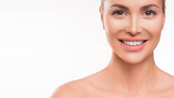 Smiling woman on white background. Skincare, dental and spa concept. - Fotoğraf, Görsel