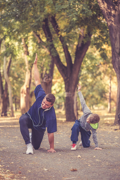 Father and his son working out together - Foto, Imagem