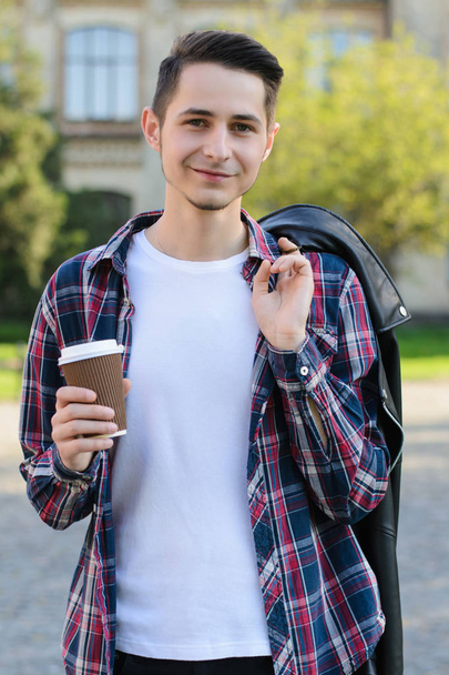 Vertical photo of confident cheerful calm guy holding tasty beve - Photo, image